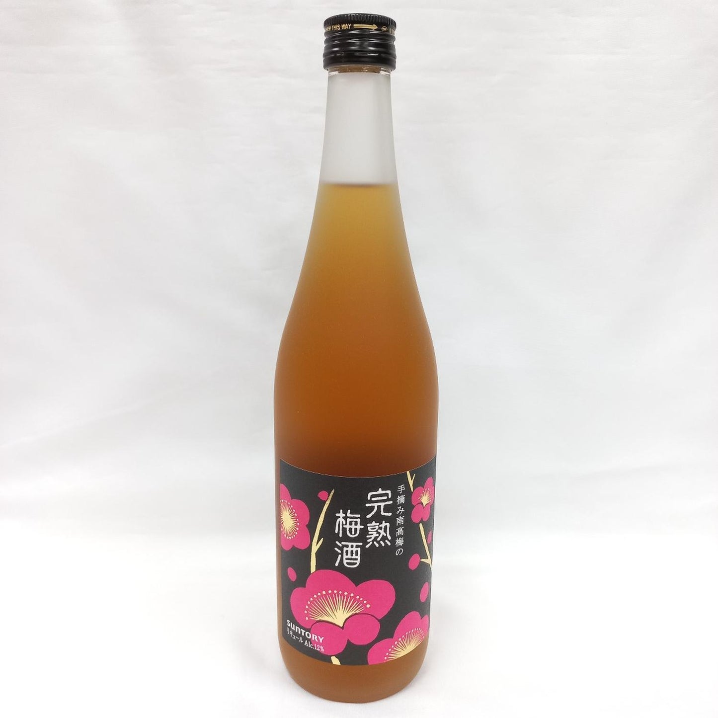 A bottle of plum wine with a label featuring floral graphics.